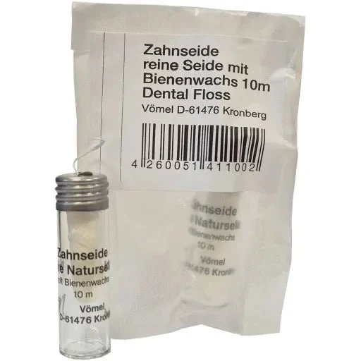 Zahnseide im Glasflacon